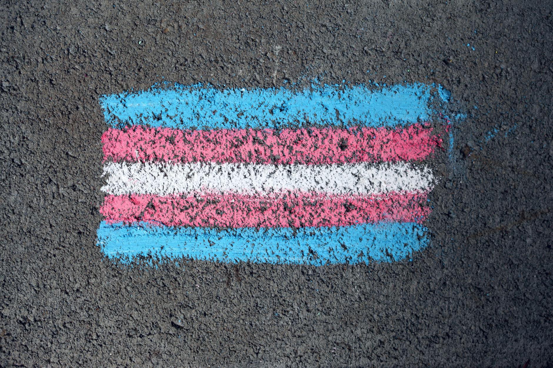 a pride flag drawn on the ground